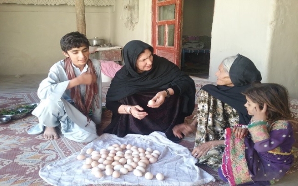 A woman-headed family involved in poultry and egg production