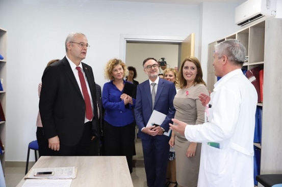 Swiss Ambassador Adrian Maître and Albania's Minister of Health Ogerta Manastirlliu visiting the renovated health centre in Lushnje.