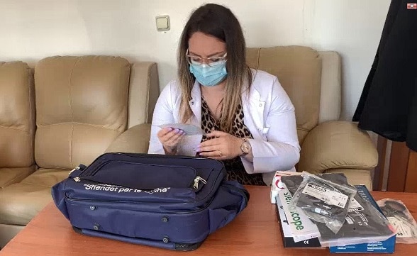 Nurse at the health centre in Aliko, Finiq, receives bags with supplies and tools for treatment of Covid-19 and other conditions. 