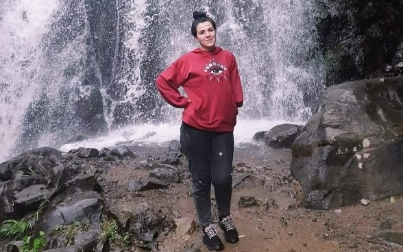 Ilona posing in front of the waterfall