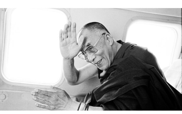 The Dalai lama greets