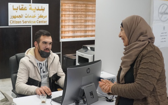 local woman benefiting from the services at the “One-stop shop” in Aqabba Municipality in the West Bank. The center was established under the Municipal Development Fund supported by SDC.