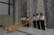 Six Swiss musicians in traditional attire give an alphorn concert in the new climbing gym in the town of Sátoraljaújhely. 