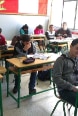 a classroom full of girls and boys.
