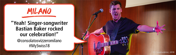 Bastian Baker at a concert in Milan. Twitter username in the speech bubble: @consolatosvizzeromilano, #MySwiss18