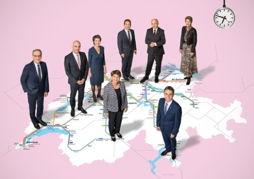 Vue d'en haut sur les membres du Conseil fédéral représentés sur une carte de la Suisse.