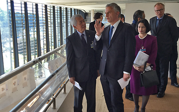 Didier Burkhlater talks with his Philippine counterpart, Perfecto Yasa.