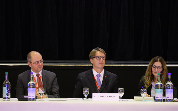 Benno Bättig  and François Wisardduring the plenary assembly at a table.