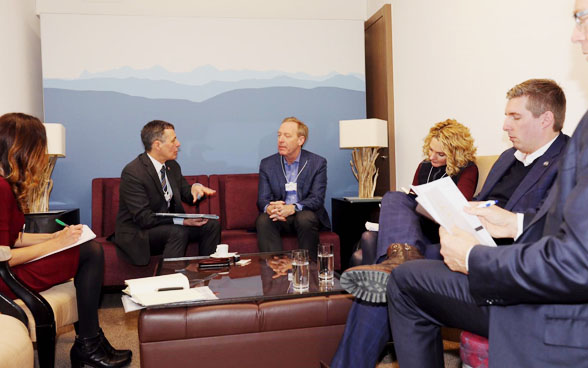 Federal councillor Ignazio Cassis meets Brad Smith, the President of Microsoft, during the WEF.