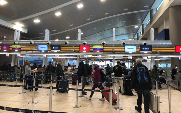 At Mariscal Sucre International Airport on April 3, passengers on the Quito-Zurich flight check-in. 