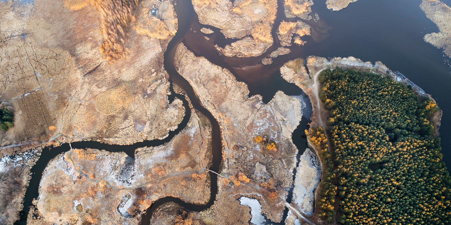 The course of a river between two countries which flows into a lake in a barren region.