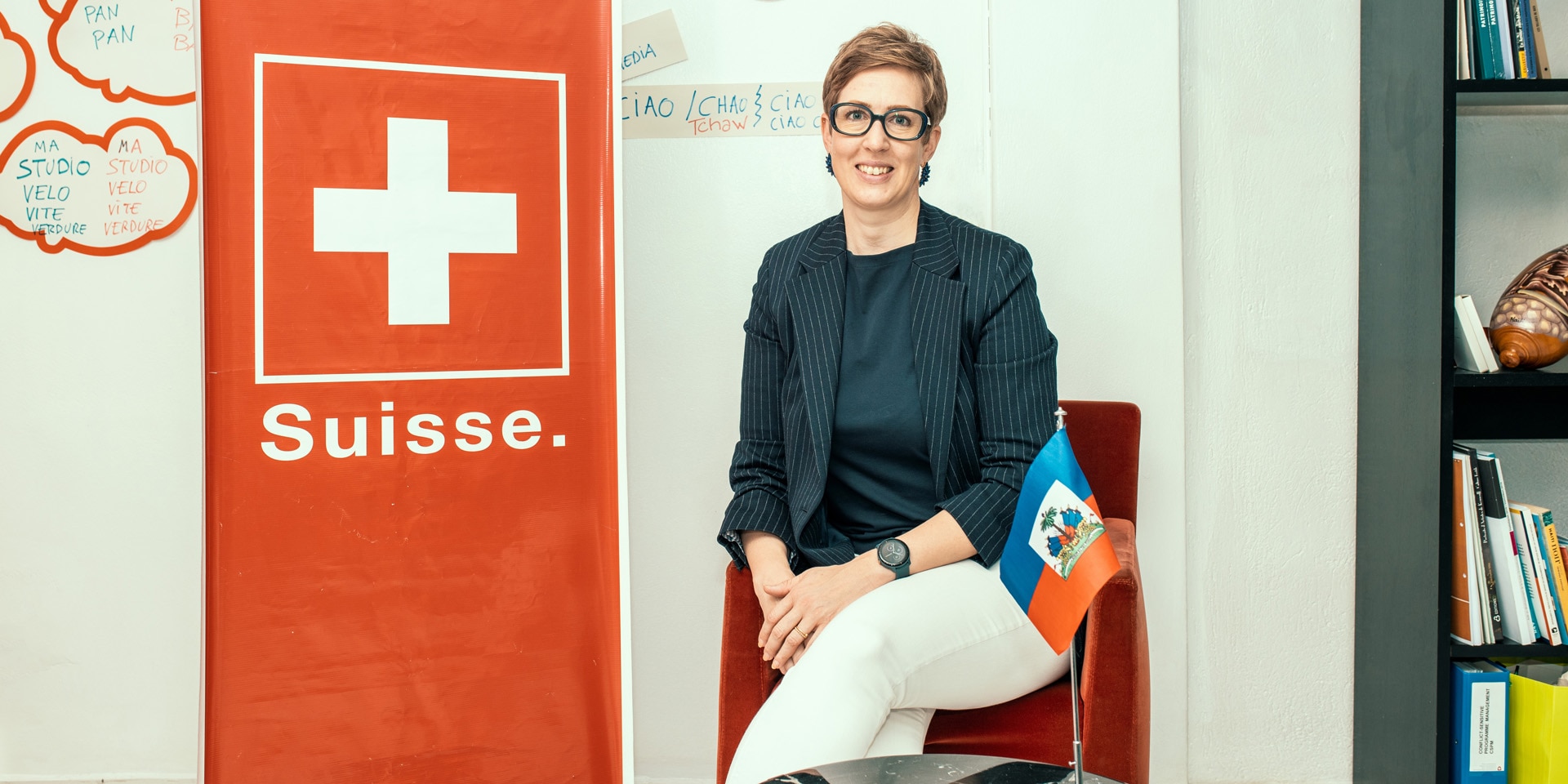 Ariela Kraska in front of the Swiss flag. 