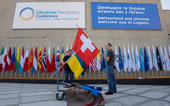 The flags of Switzerland and Ukraine are displayed at the Congress Centre in Lugano.