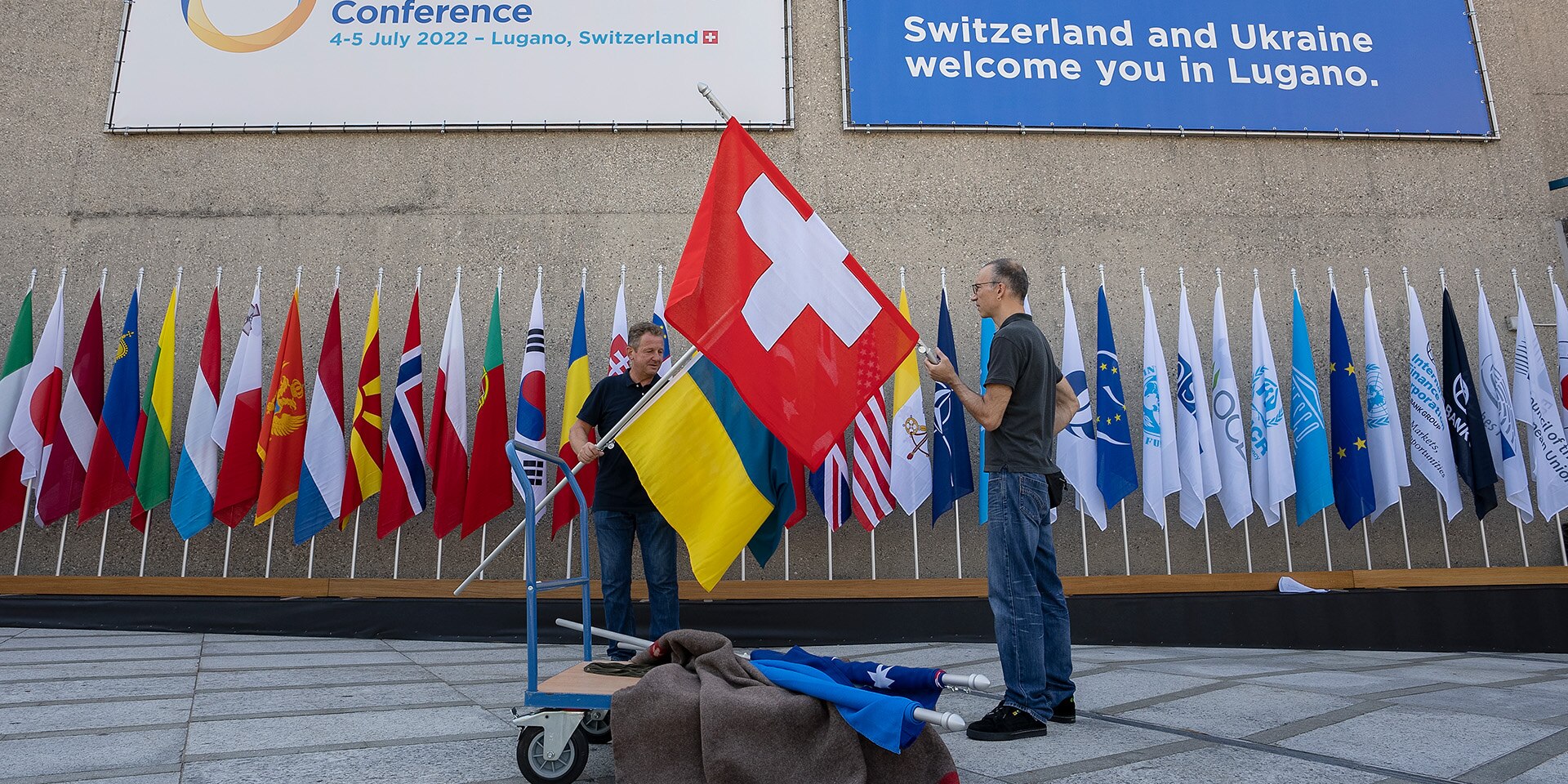 The flags of Switzerland and Ukraine are displayed at the Congress Centre in Lugano.