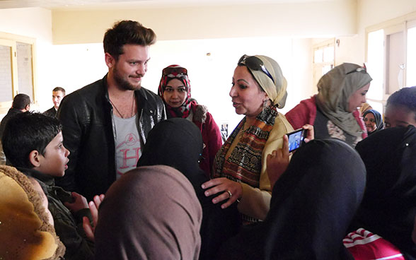 Bastian Baker standing in a group of people.