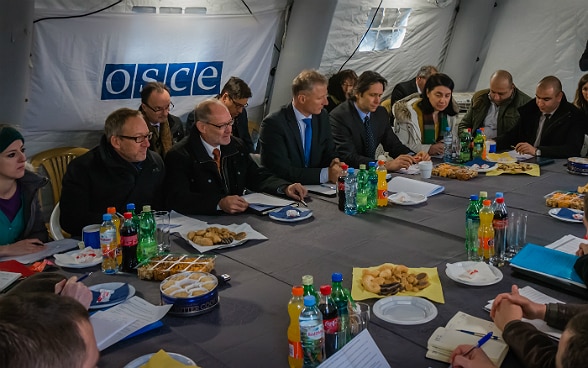 Swiss OSCE representatives lead a meeting of Russian, South Ossetian and Georgian delegations in a tent near the administrative boundary line at Ergneti Georgia.