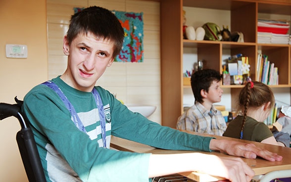 A young disabled man in a social services facility in Stará L'ubovňa.