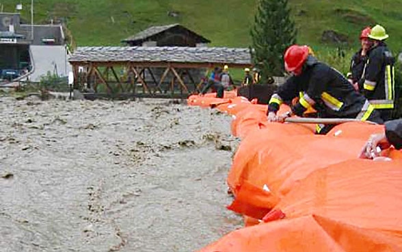  Men inflating mobile dams