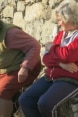 two old women sitting on a bench