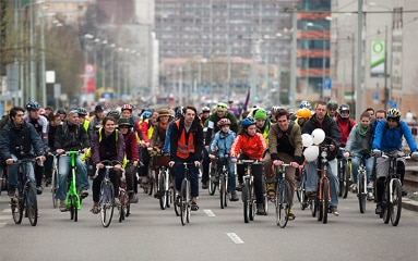 A large group of cyclists in a city